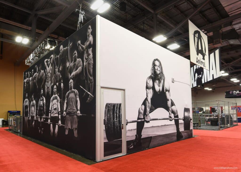Animal supplements tradeshow booth design with weight lifter deadlifting