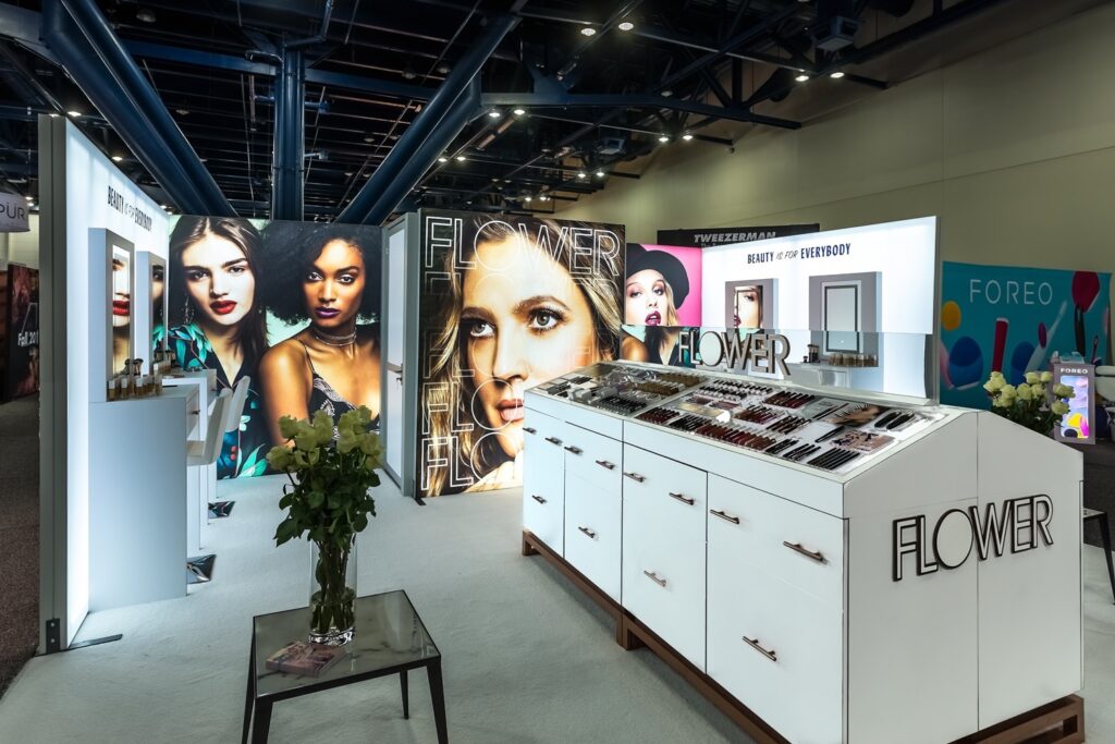 custom island booth for cosmetics at beautycon | Impactful Trade Booth Design